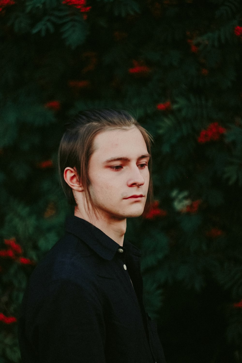 man in black collared shirt