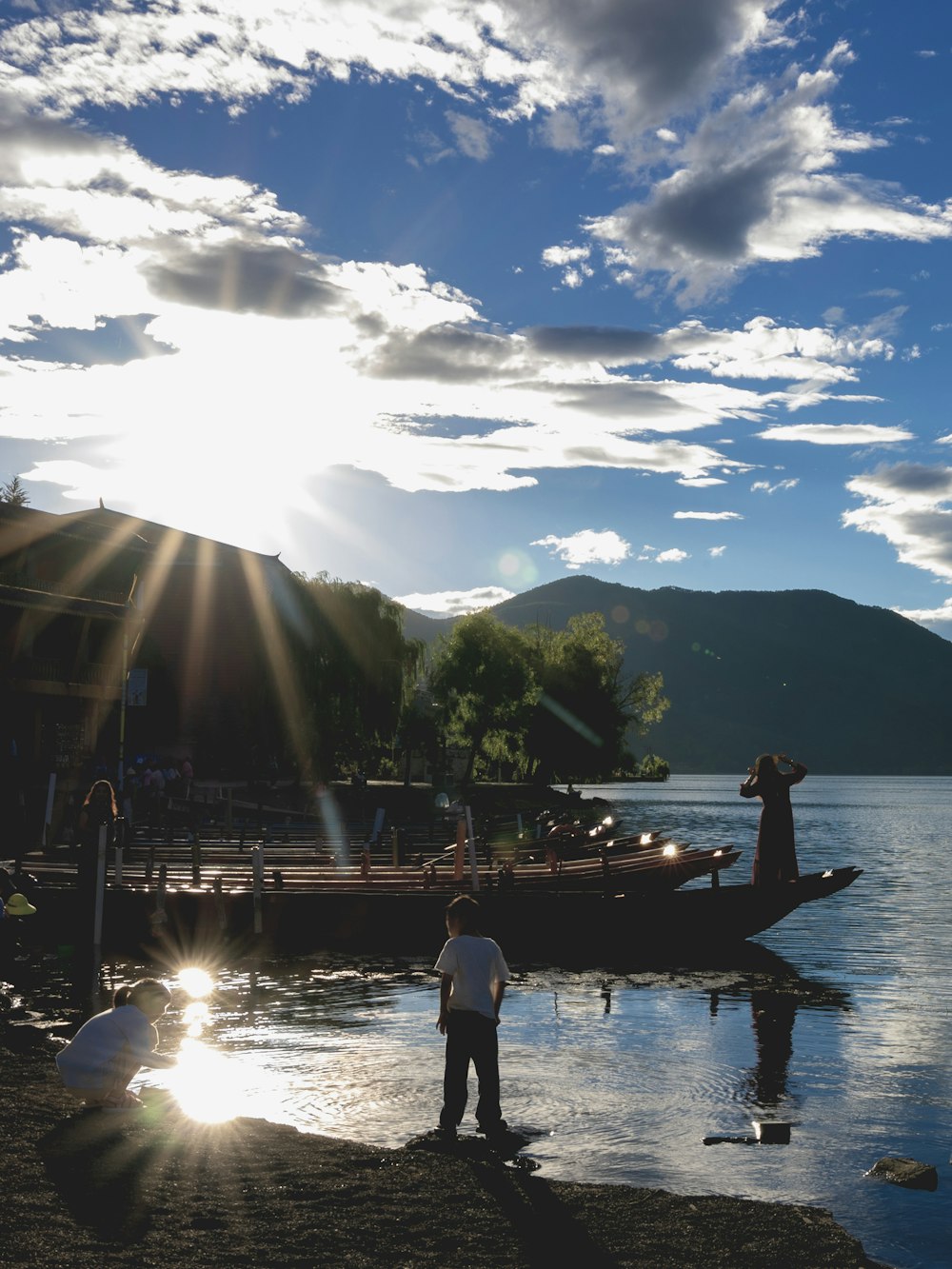 man in white shirt standing on boat during daytime