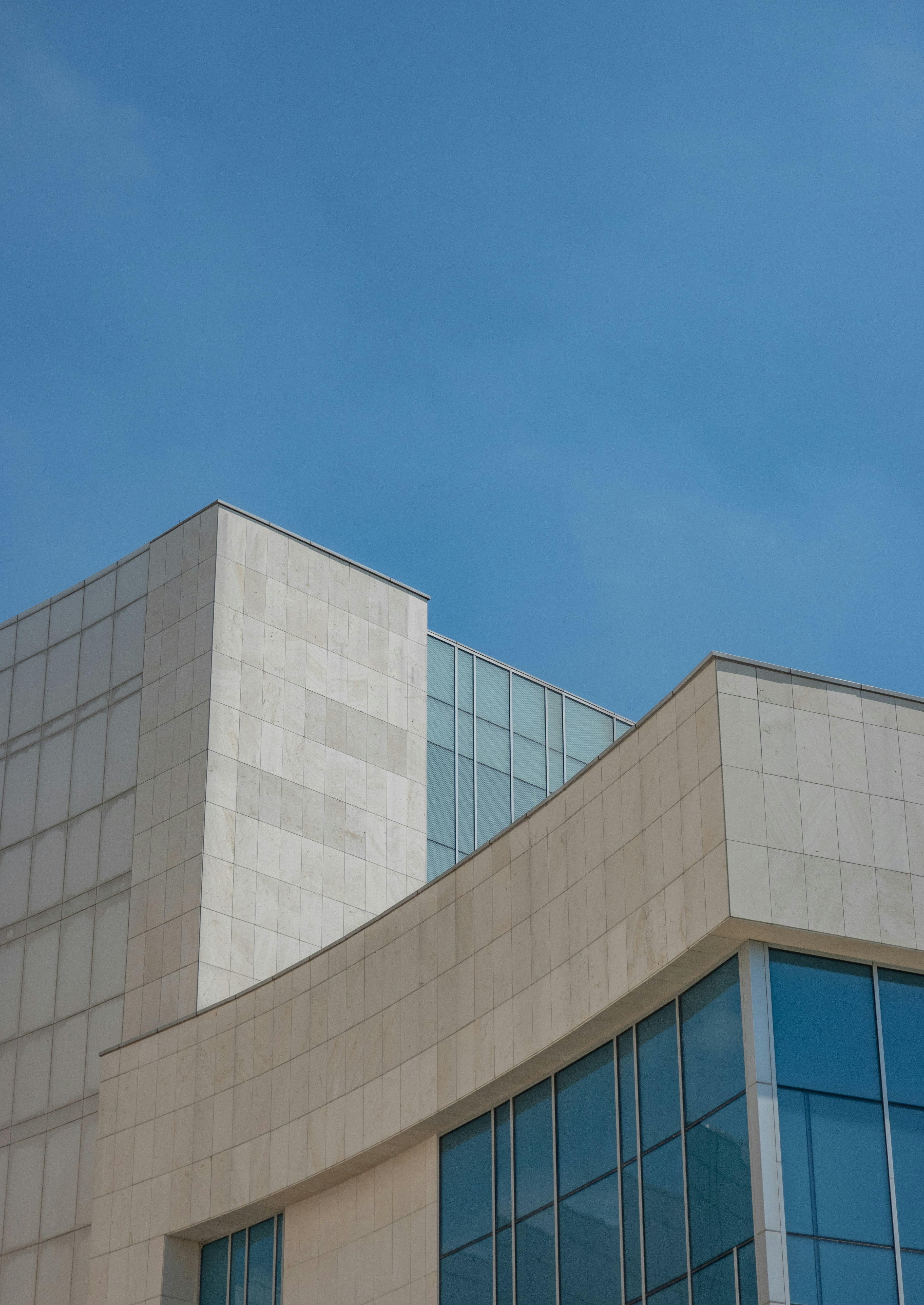 white concrete building under blue sky during daytime