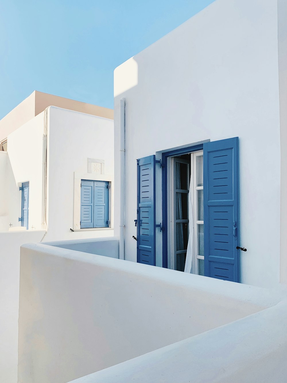 white and blue wooden window