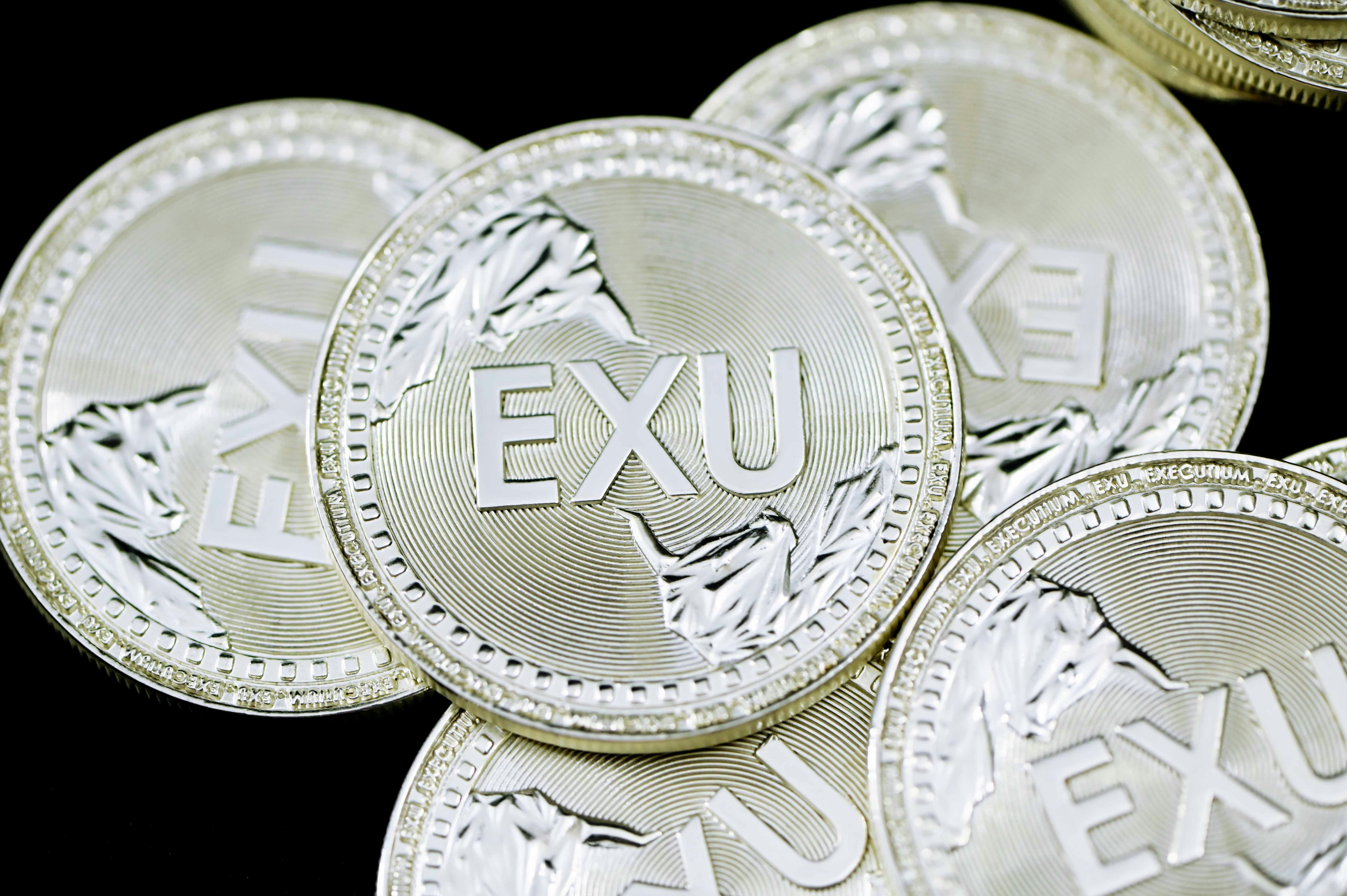 A group of scattered silver EXU coins