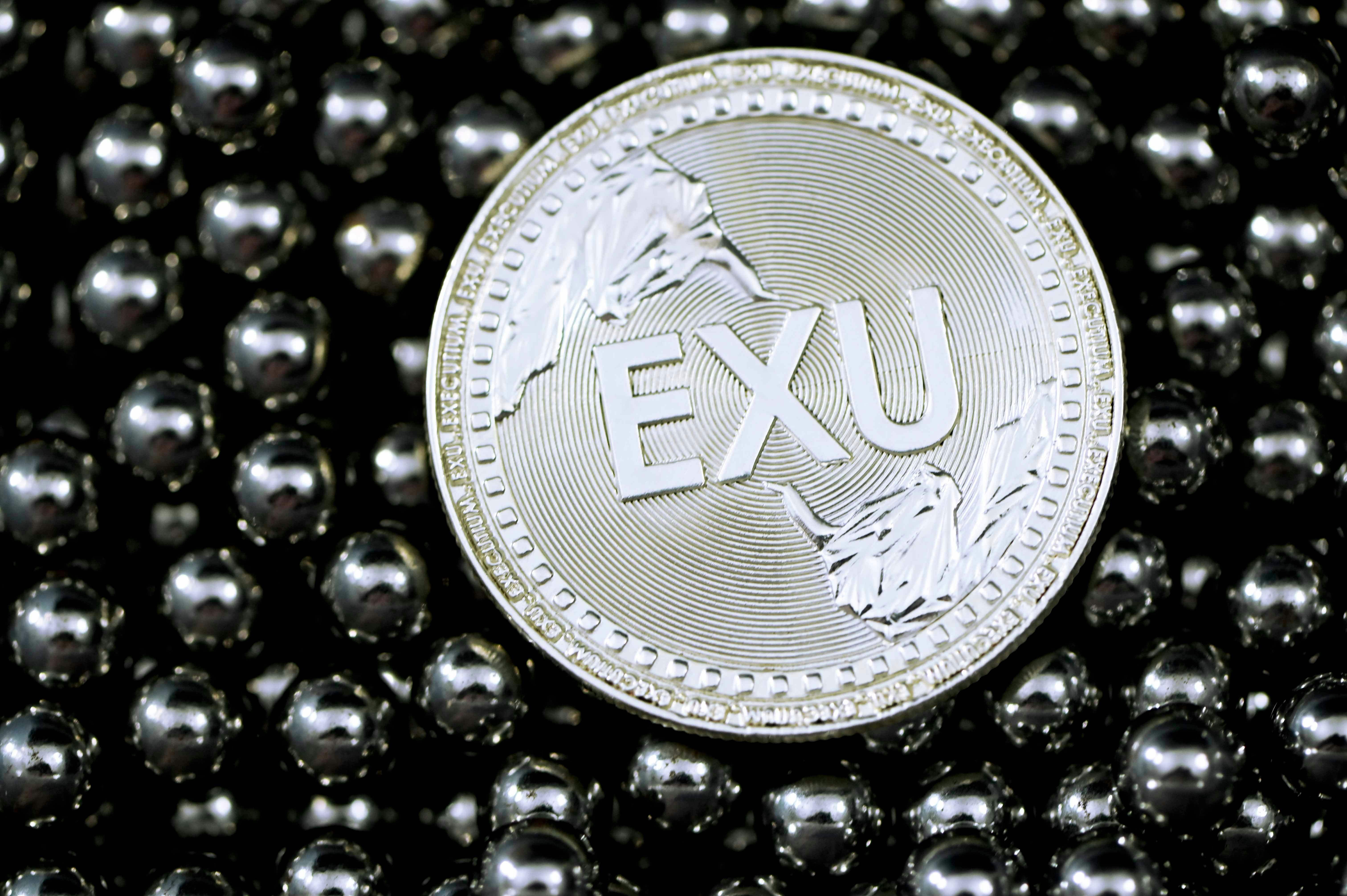 silver and gold round coin