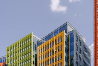 Modern office building exterior being painted with precision and care.