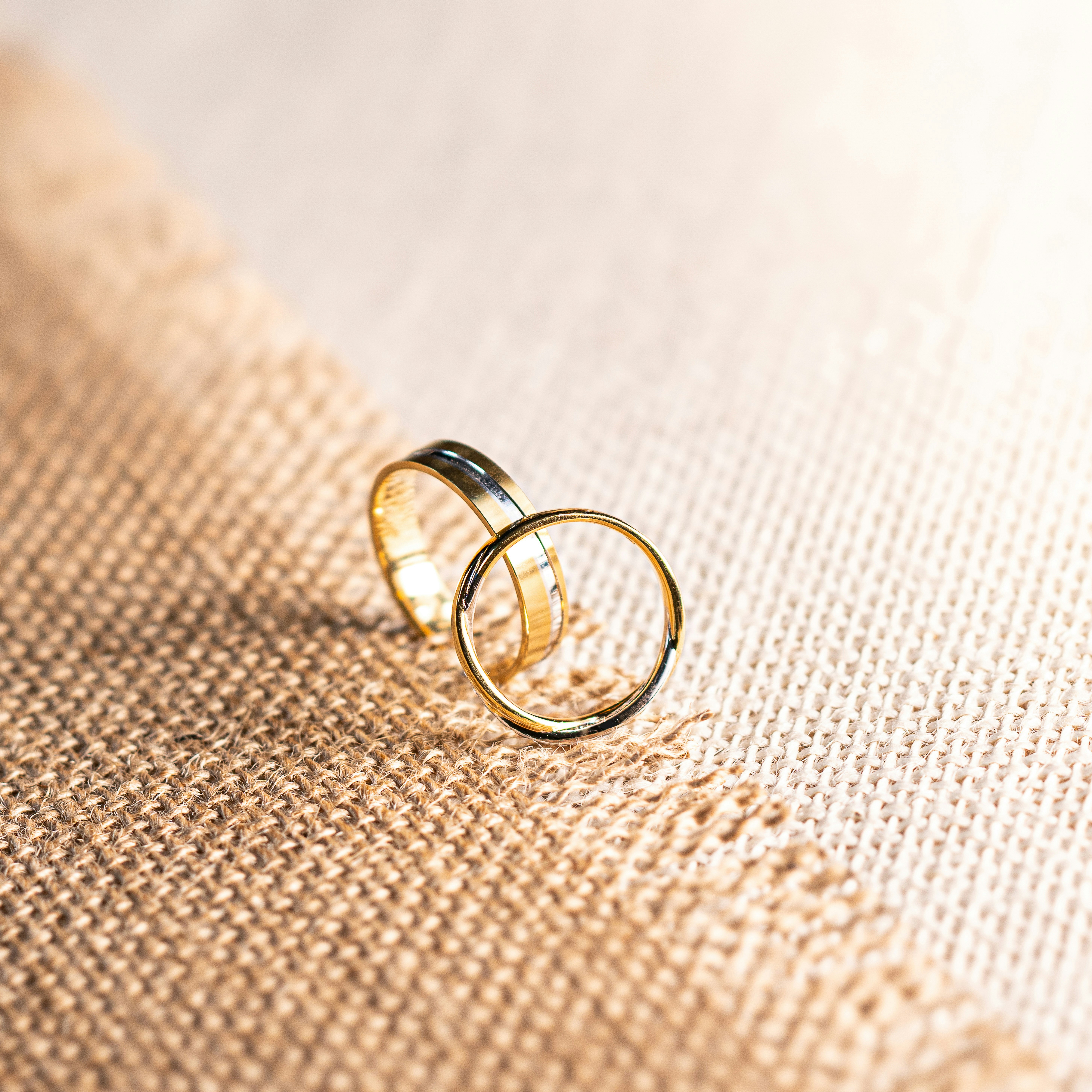 silver ring on brown textile