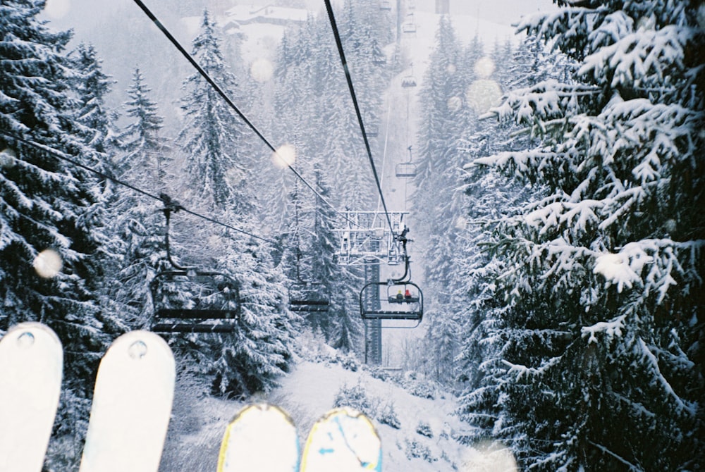 black cable cars on snow covered ground