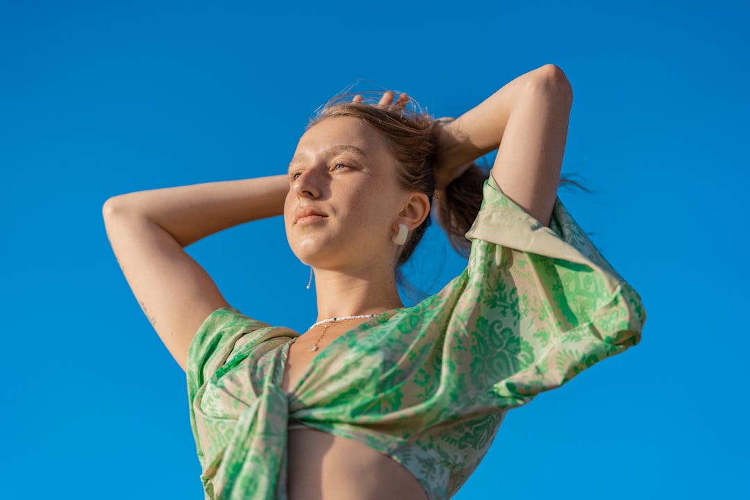 woman in green and white floral dress