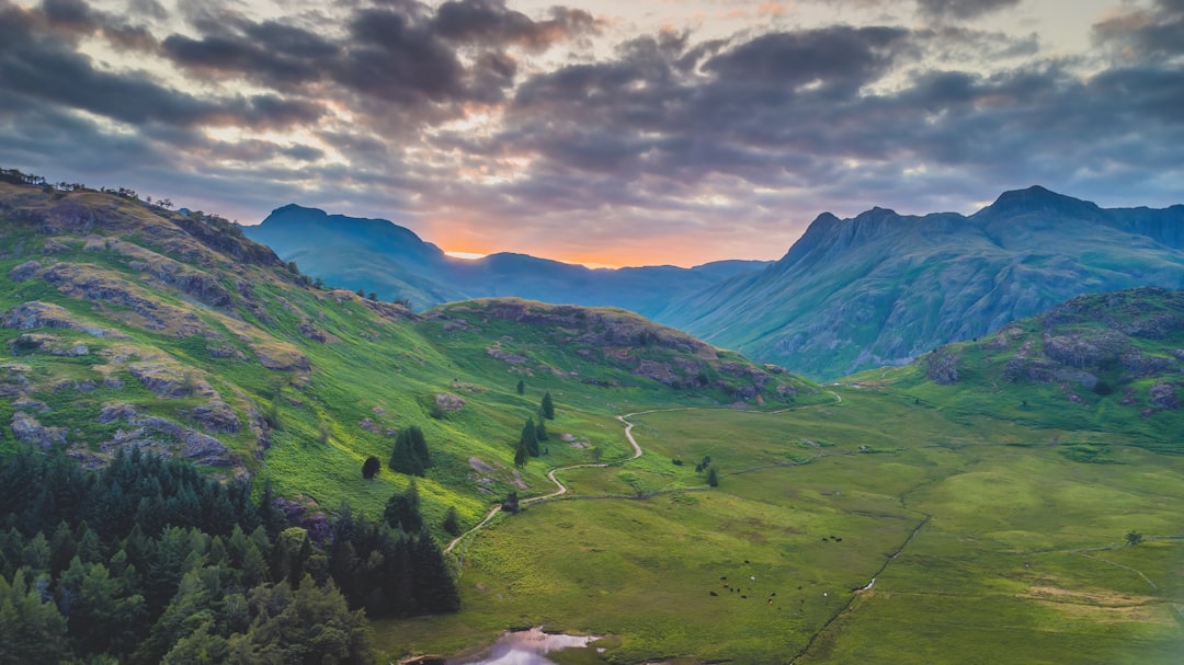 green mountains under white clouds during daytime