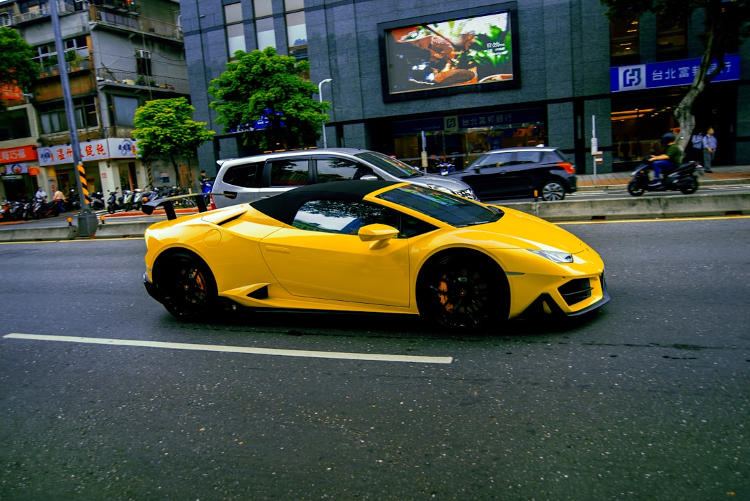 yellow ferrari 458 italia parked on street during daytime