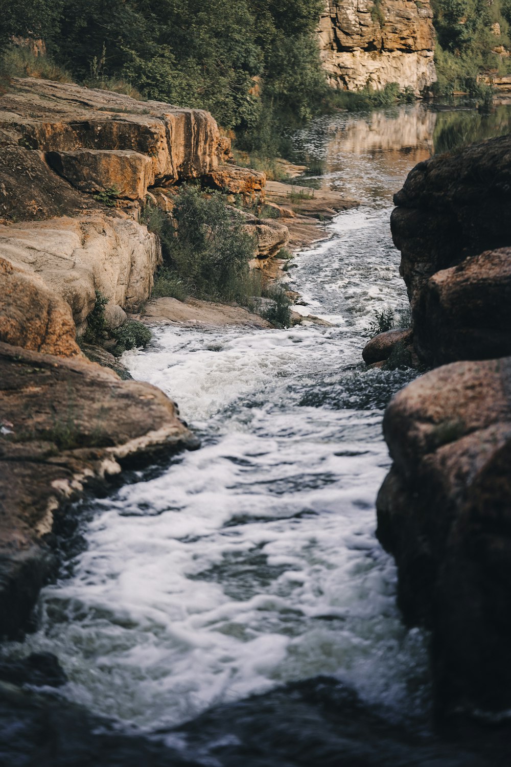 brown rocky mountain with river