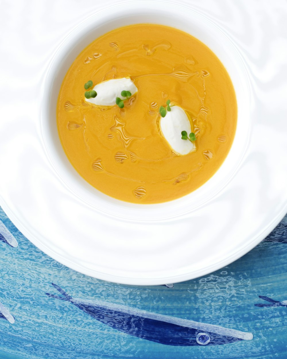 yellow liquid in white ceramic bowl