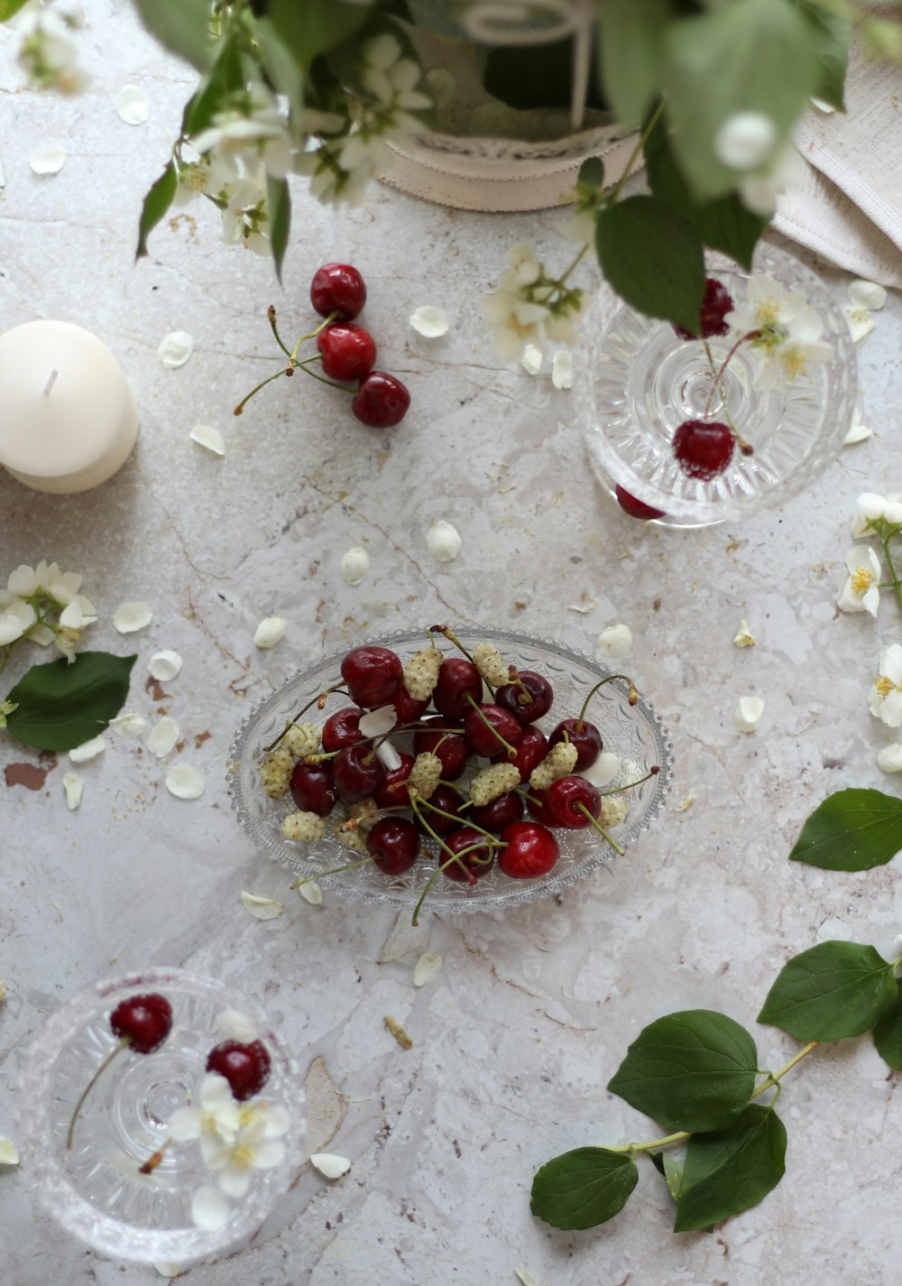 red cherries on clear glass bowl