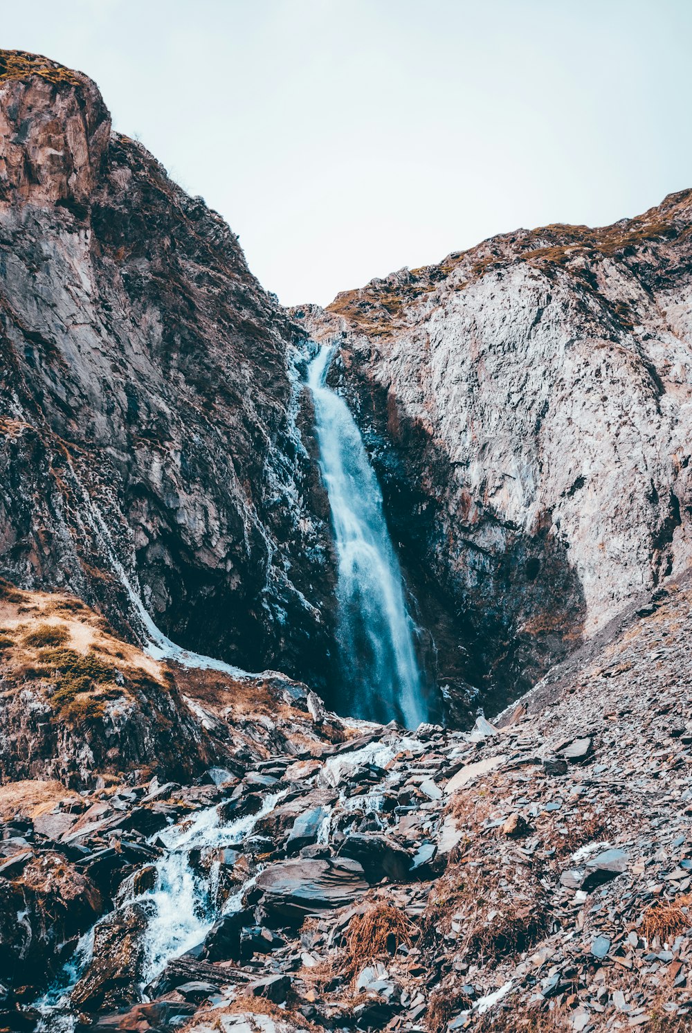 water falls on rocky mountain