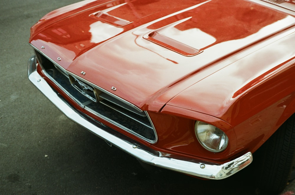 red chevrolet camaro on road