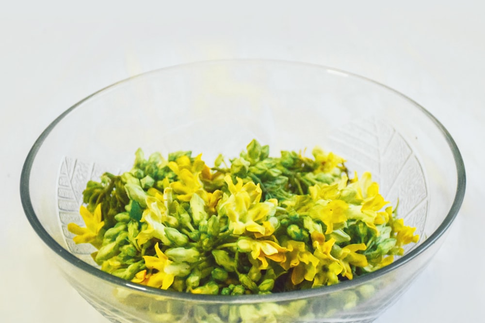 green leaves in clear glass bowl