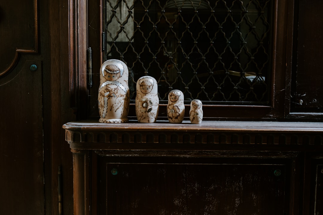 white ceramic figurines on brown wooden table