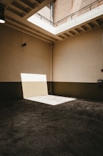 white concrete wall near black textile
