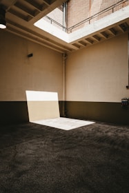 white concrete wall near black textile