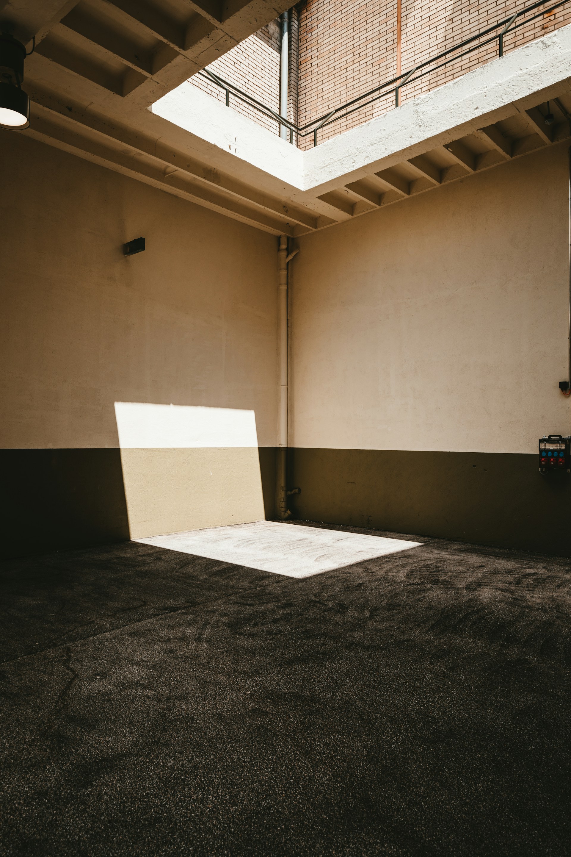 white concrete wall near black textile