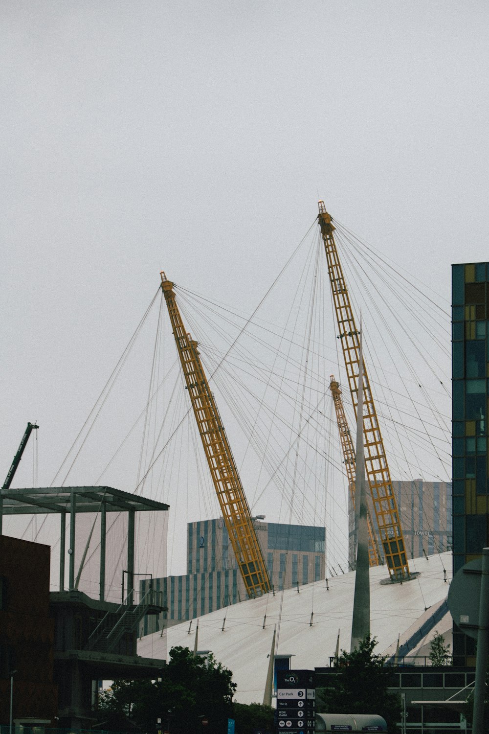 yellow crane near building during daytime