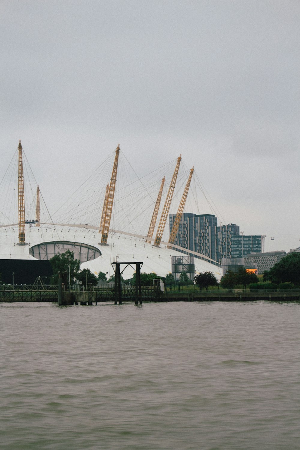 white ferris wheel near body of water during daytime