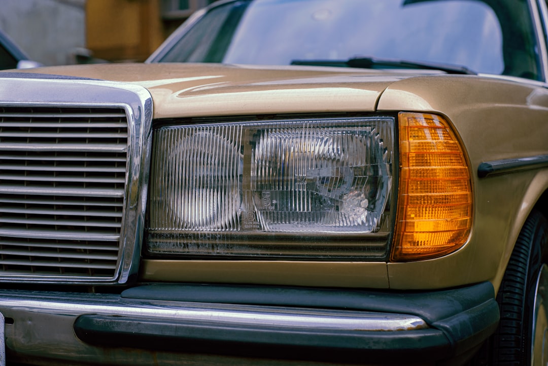 silver car with white and yellow lights