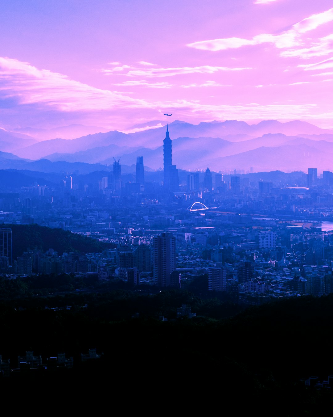 high rise buildings near mountain during daytime