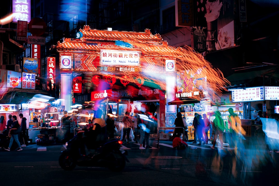 people walking on street during night time