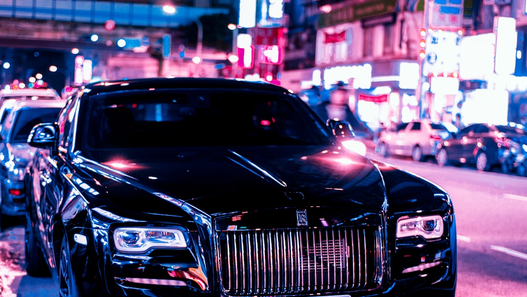 black car on the street during night time