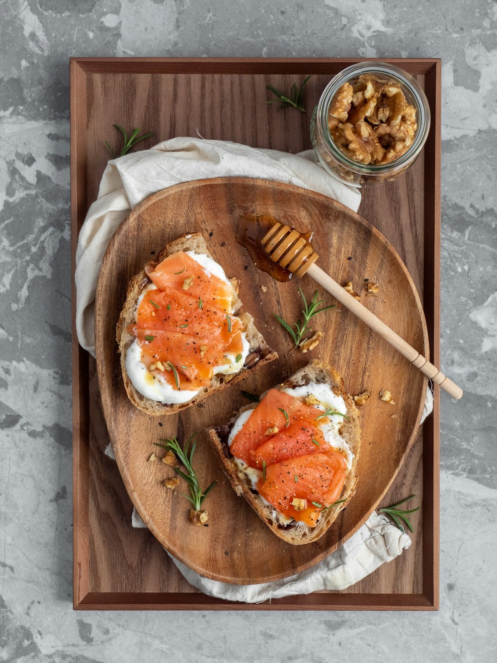 egg with orange sauce on brown wooden round plate