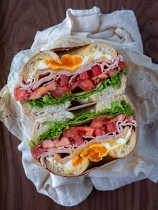 ham sandwich on white paper