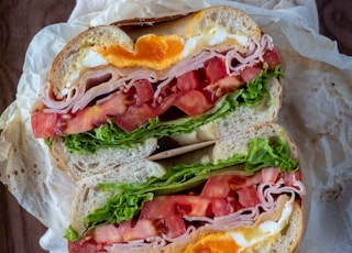 ham sandwich on white paper