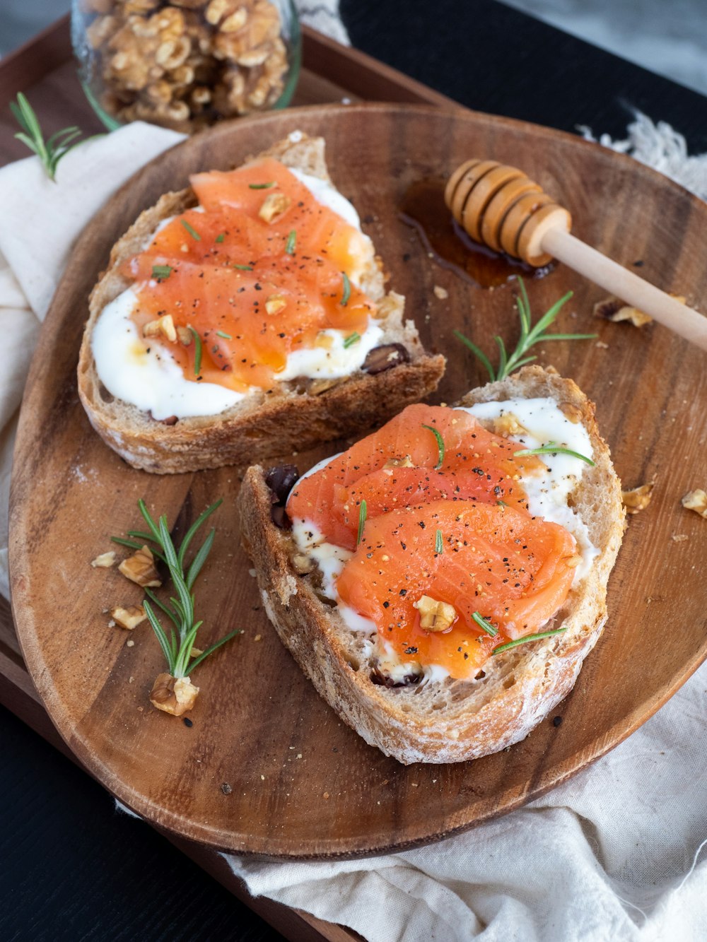 sliced bread with sliced tomato on brown wooden chopping board