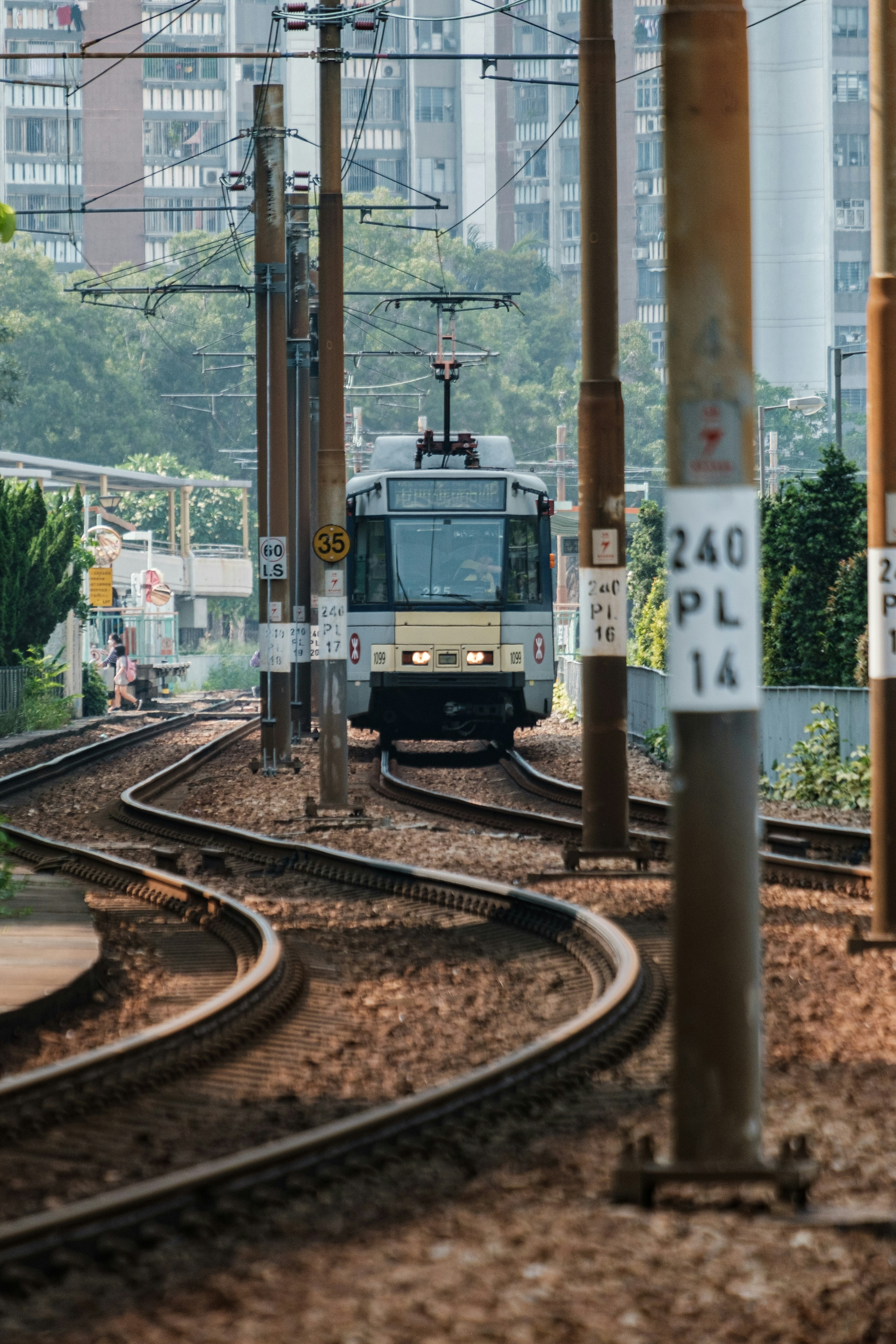 green and yellow train on rail tracks