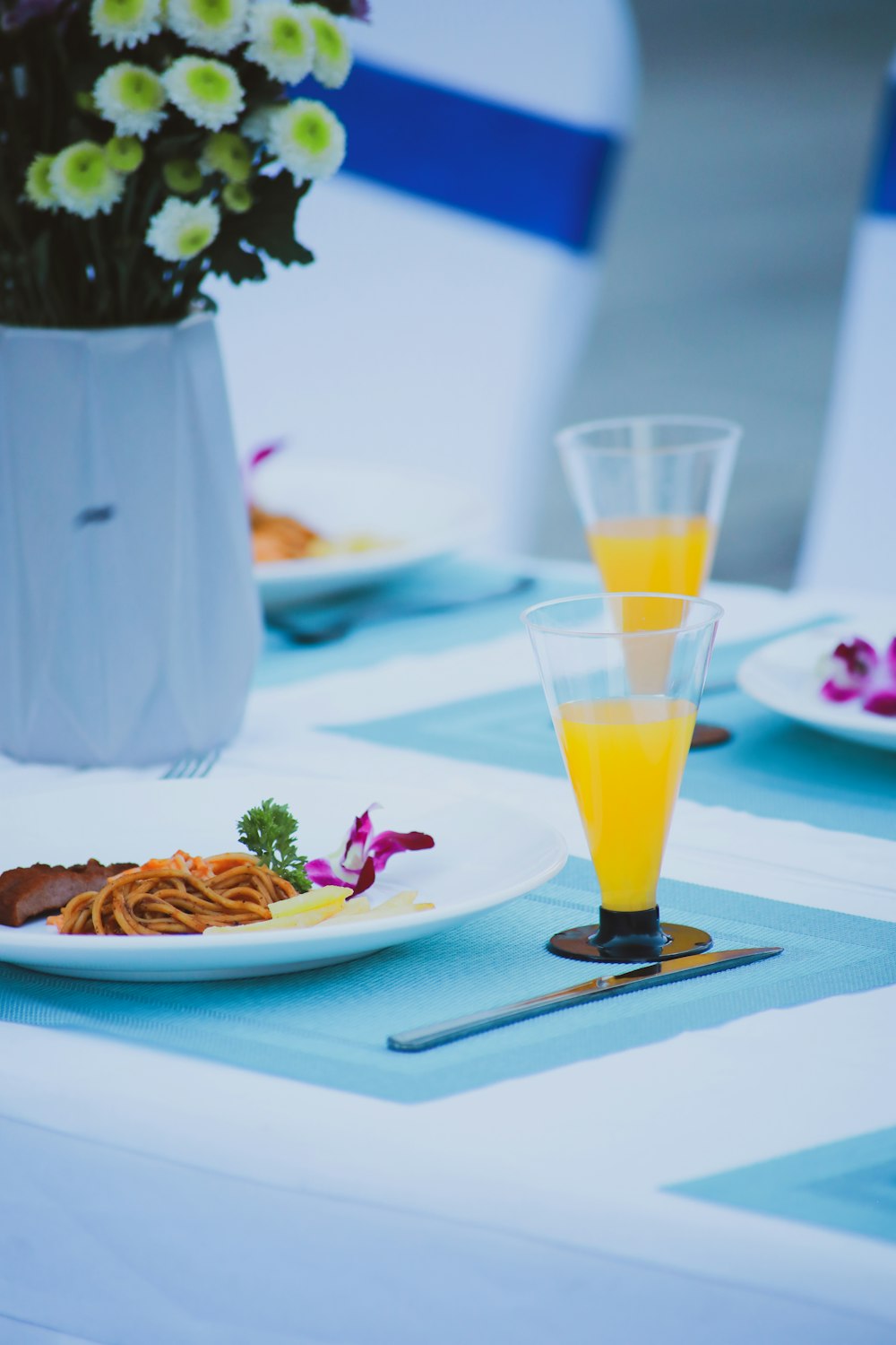 clear drinking glass with yellow liquid