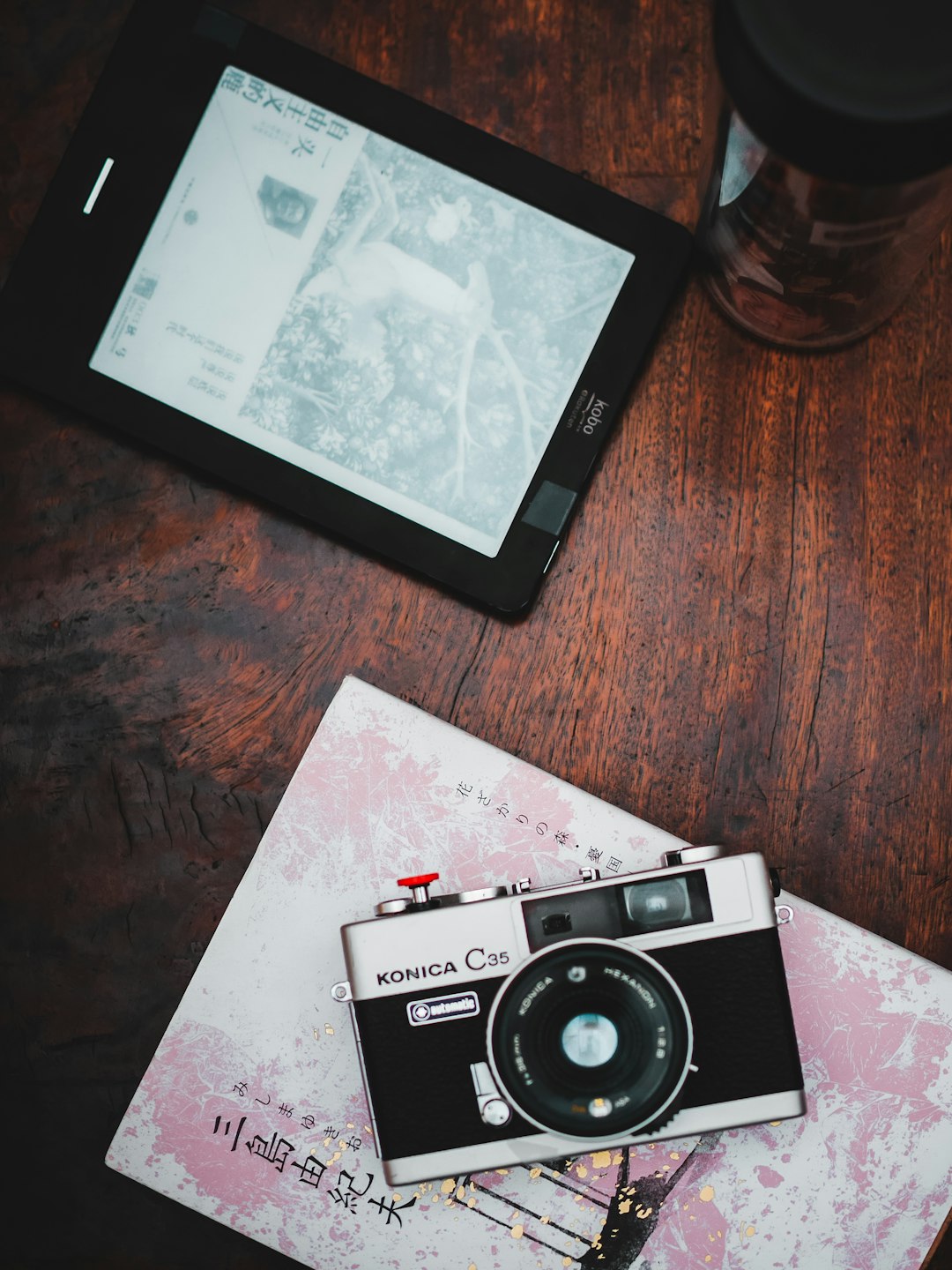 black and silver camera on brown wooden table