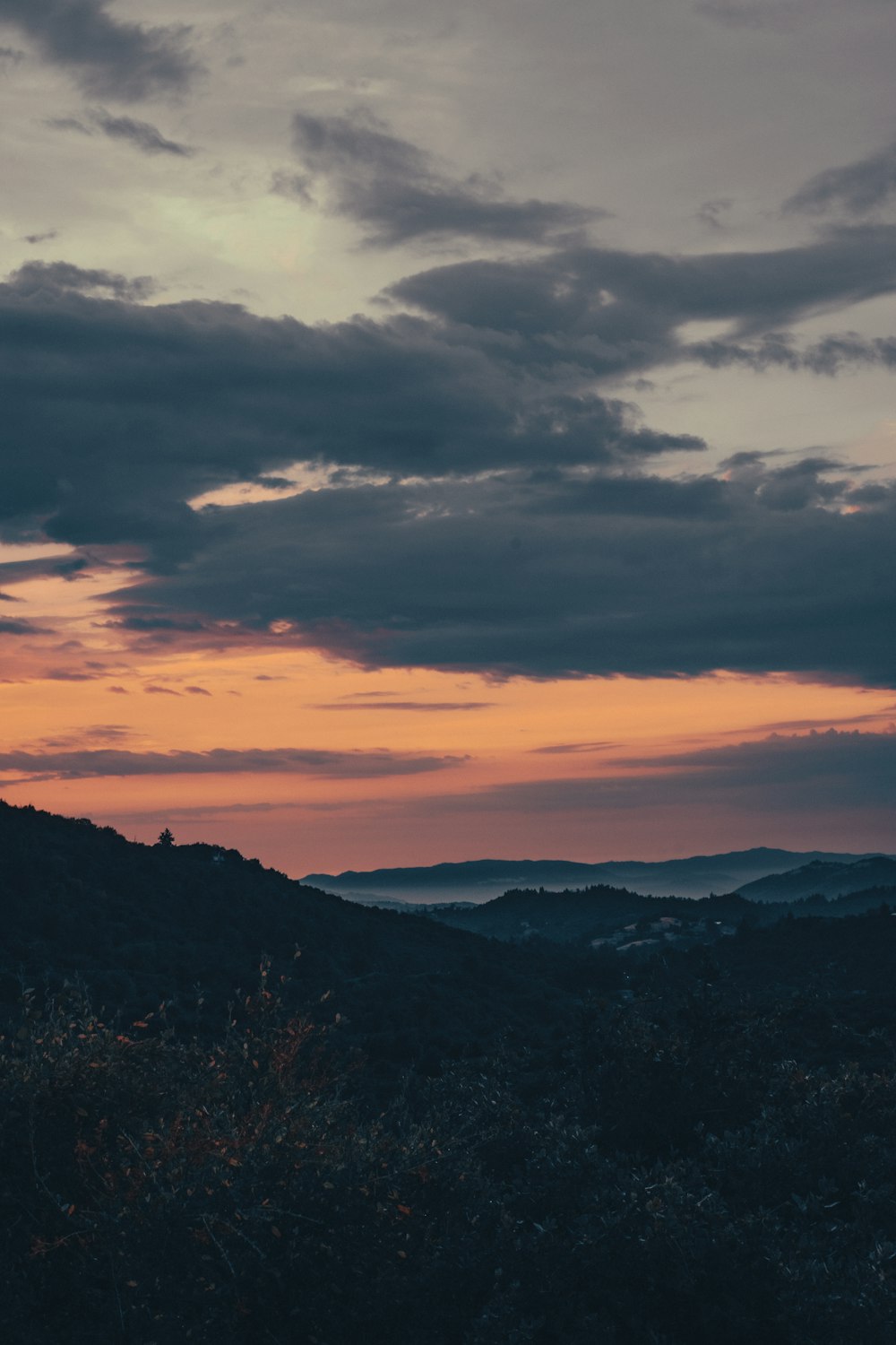 silhouette of mountains during sunset