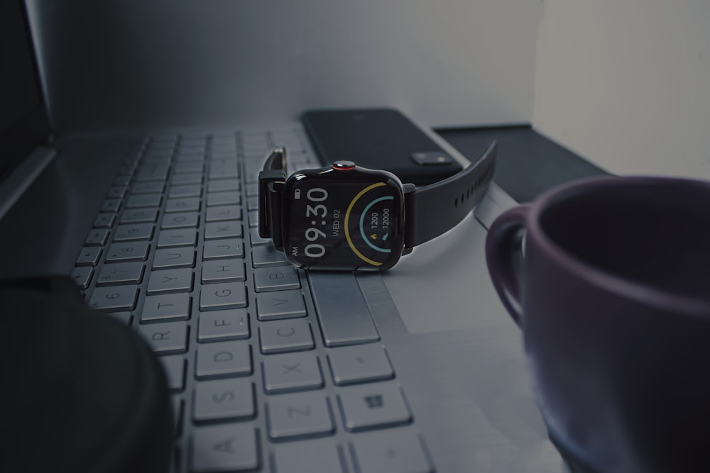black digital watch on macbook pro