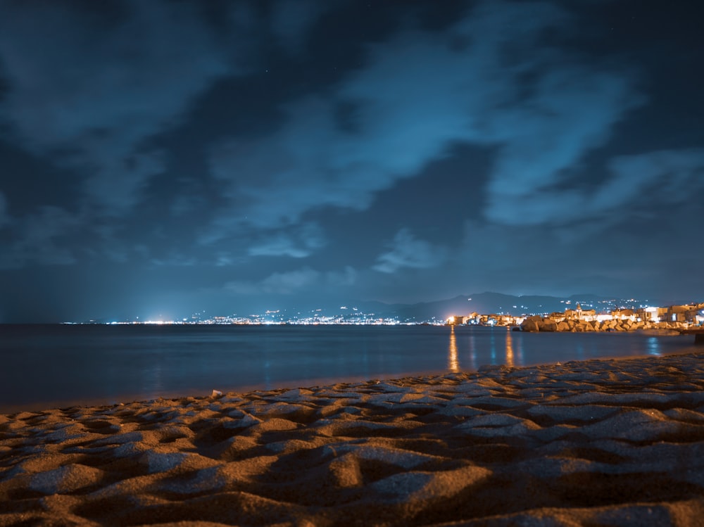 body of water under dark sky