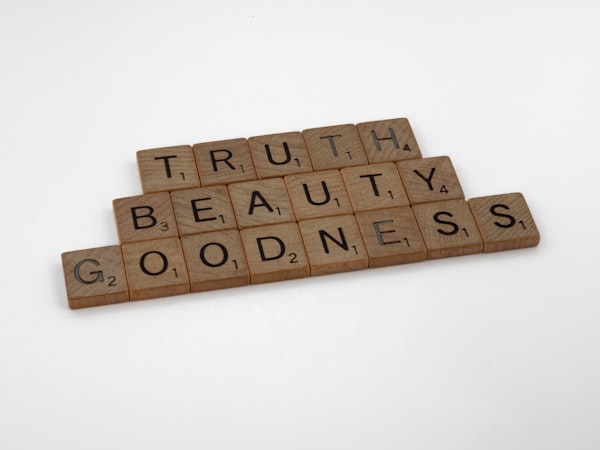 wooden blocks spelling the words "truth," "beauty," and goodness"