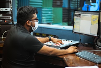 man in black long sleeve shirt using laptop computer