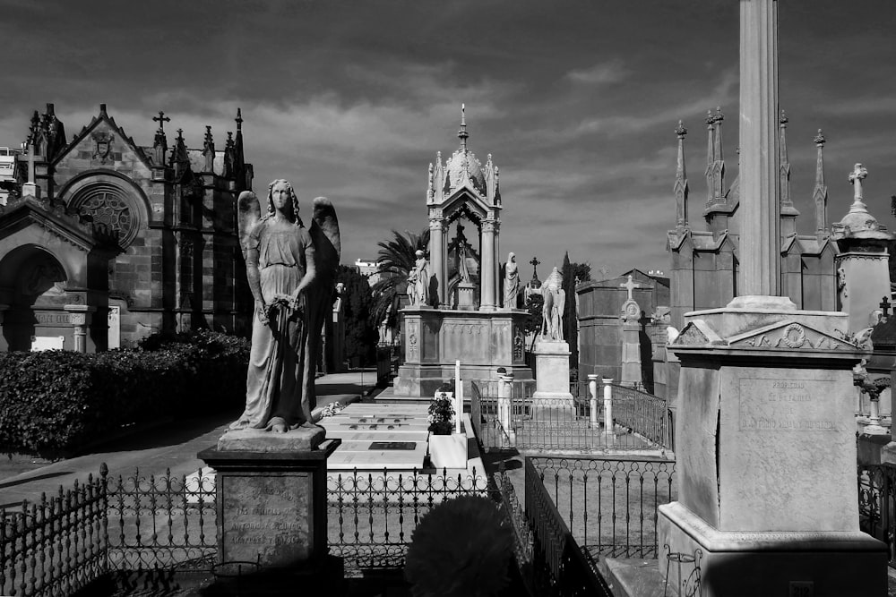 grayscale photo of statue of man and woman