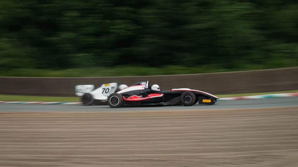 black and red f 1 on road