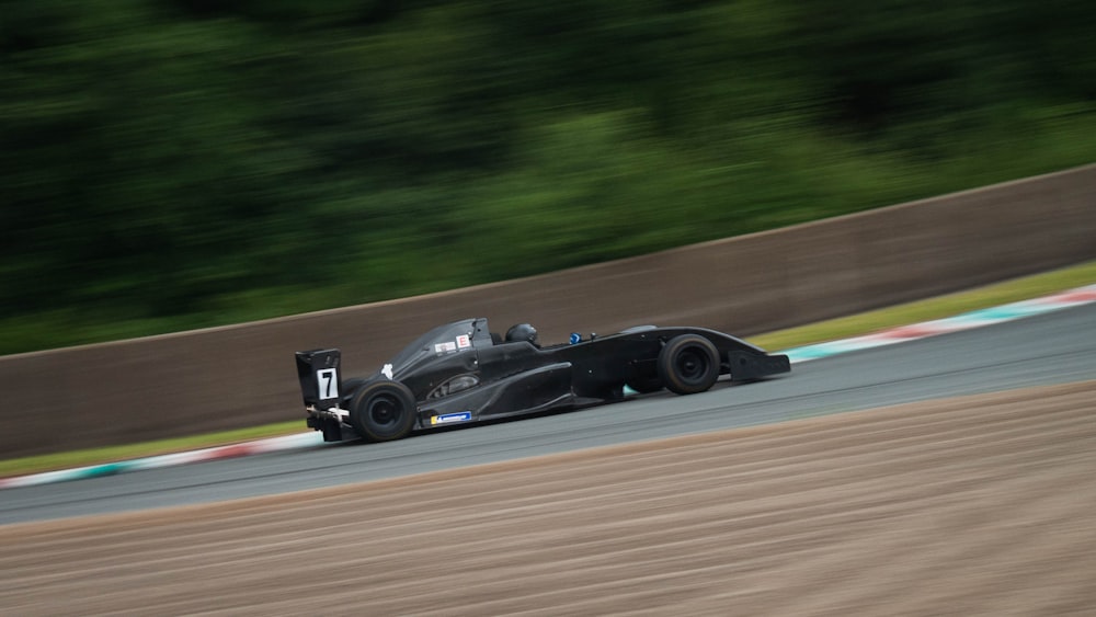 black f 1 car on road during daytime