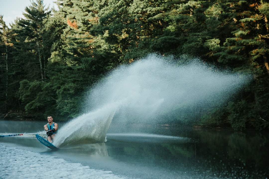 people riding on boat on river during daytime