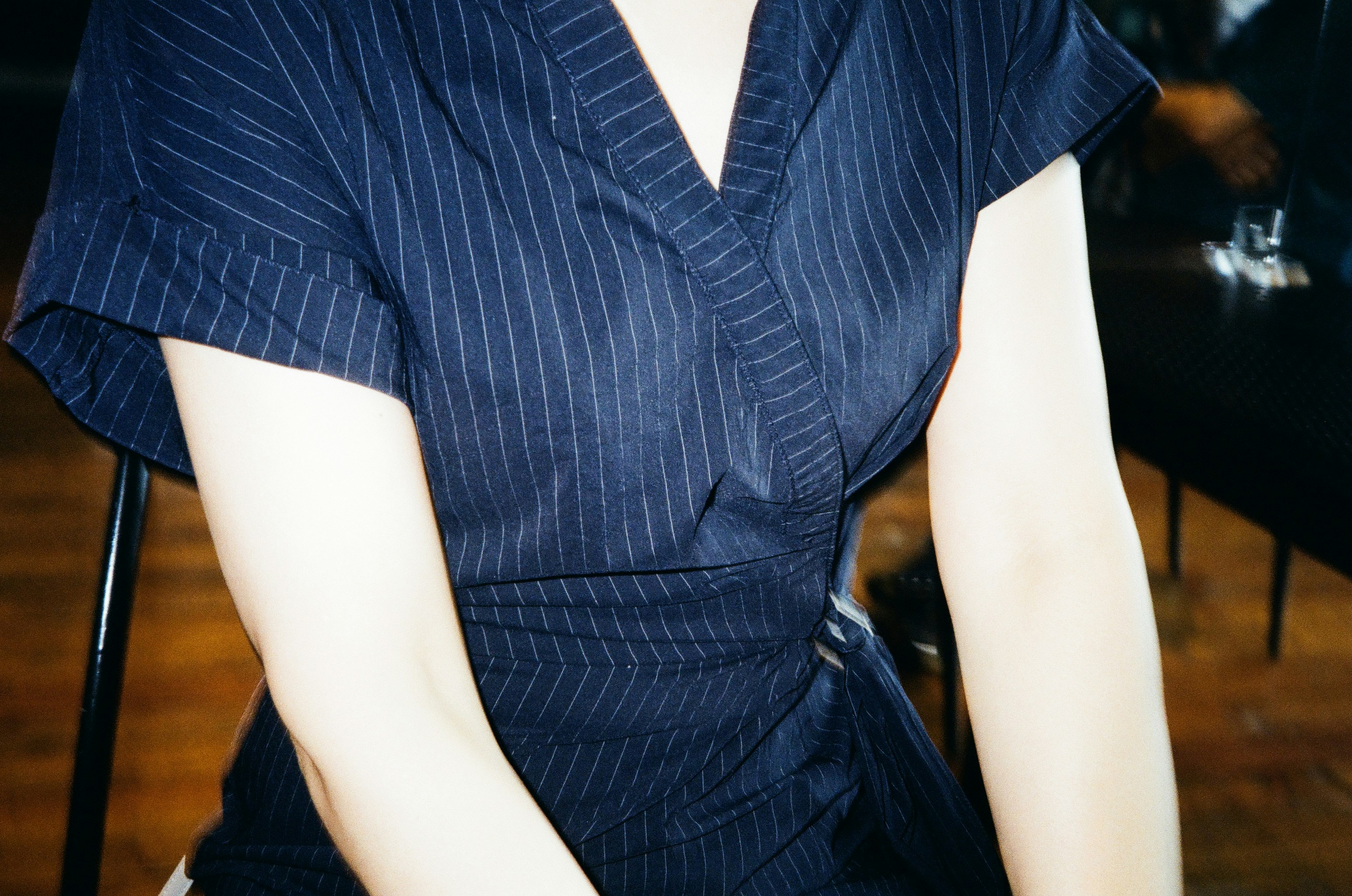 person in blue and white stripe button up shirt