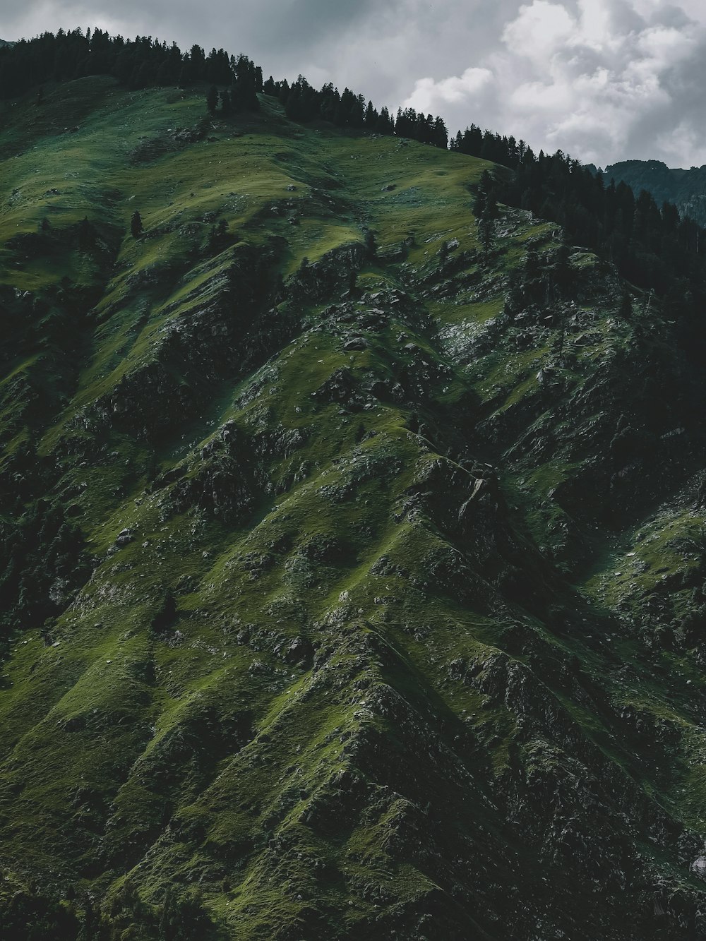 green mountain under white sky during daytime