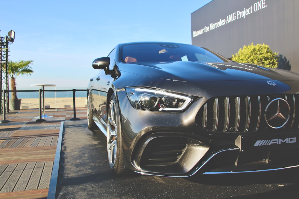 black bmw m 3 parked on parking lot during daytime