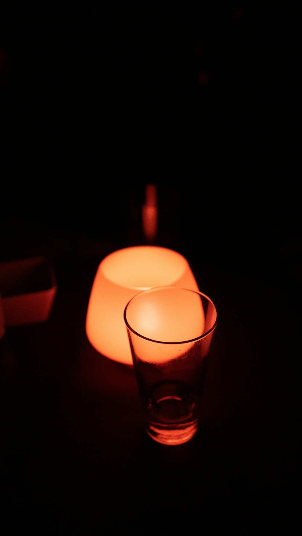 white lamp beside clear drinking glass