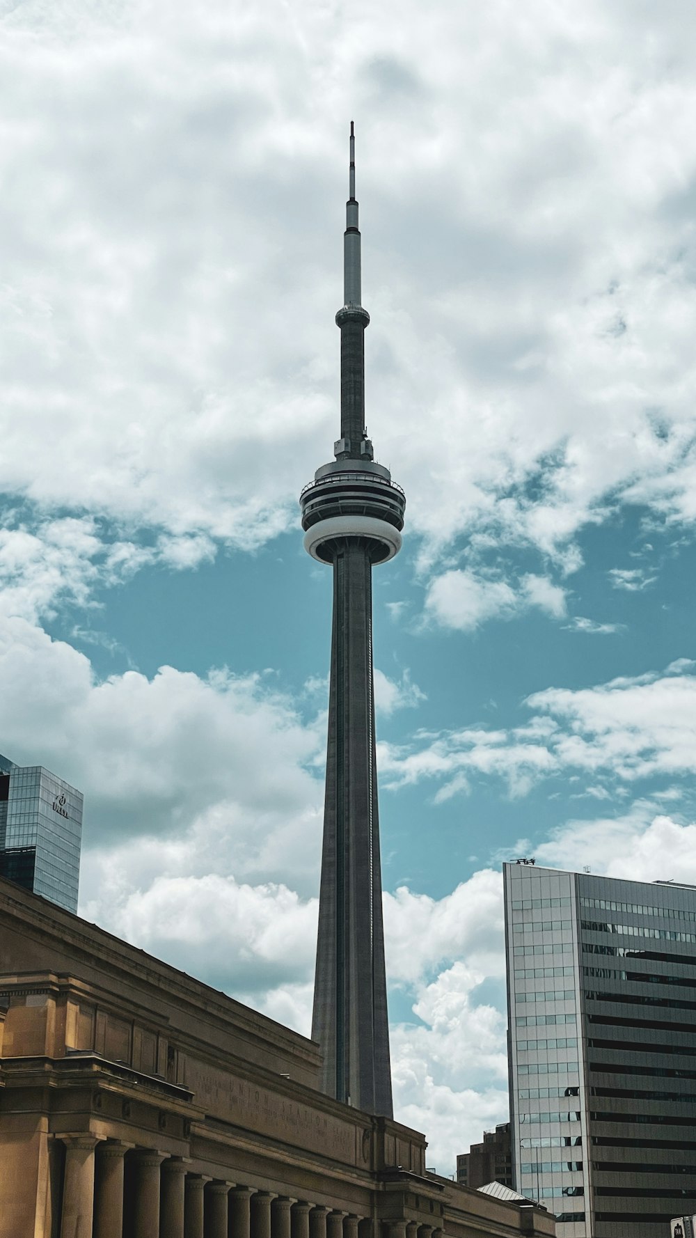 black tower under blue sky and white clouds during daytime