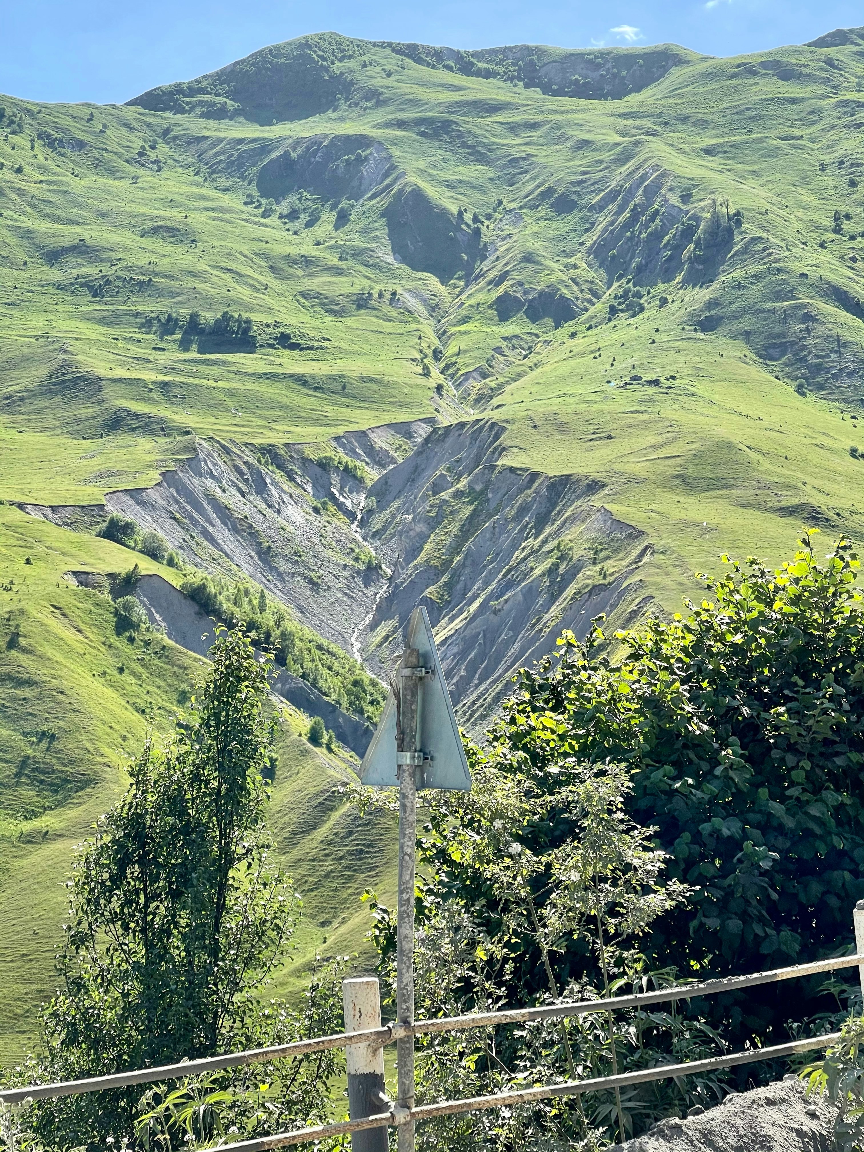green mountains under sunny sky